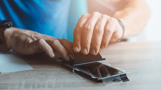 Man putting screen protector on phone